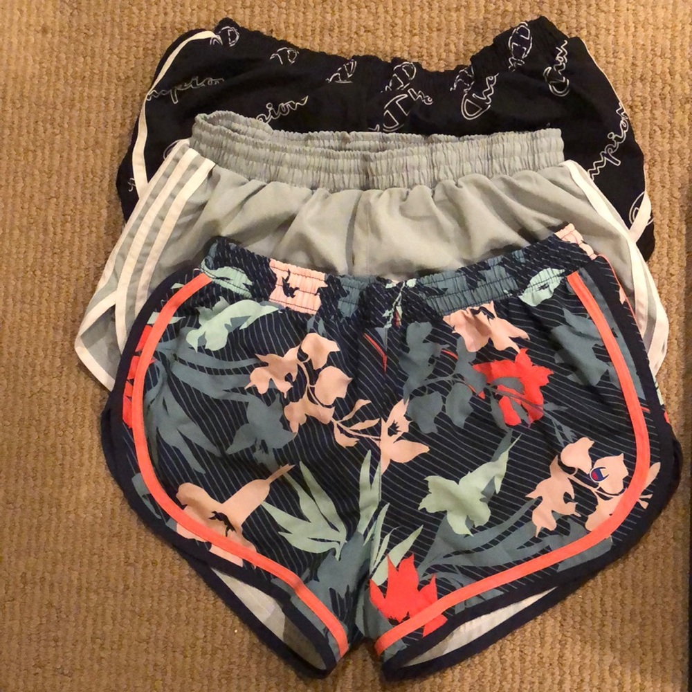 3 pairs of Champion brand running shorts. Womens size small.